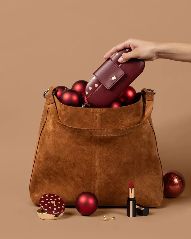 Burgundy Polka Dot 7-Day going into a suede bag